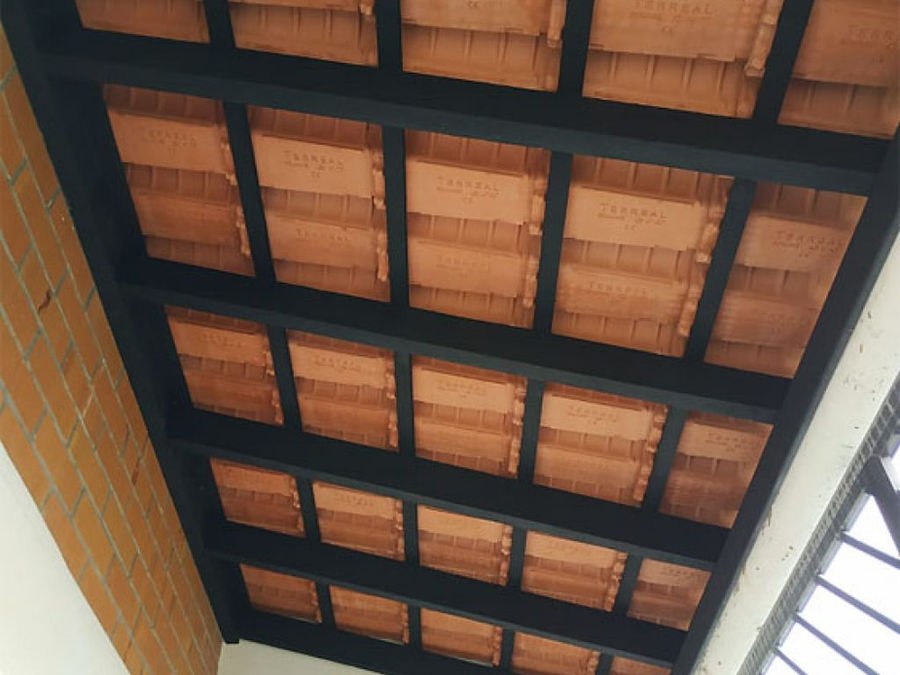 Under the eaves: newly installed, treated timber battens holding the tiles