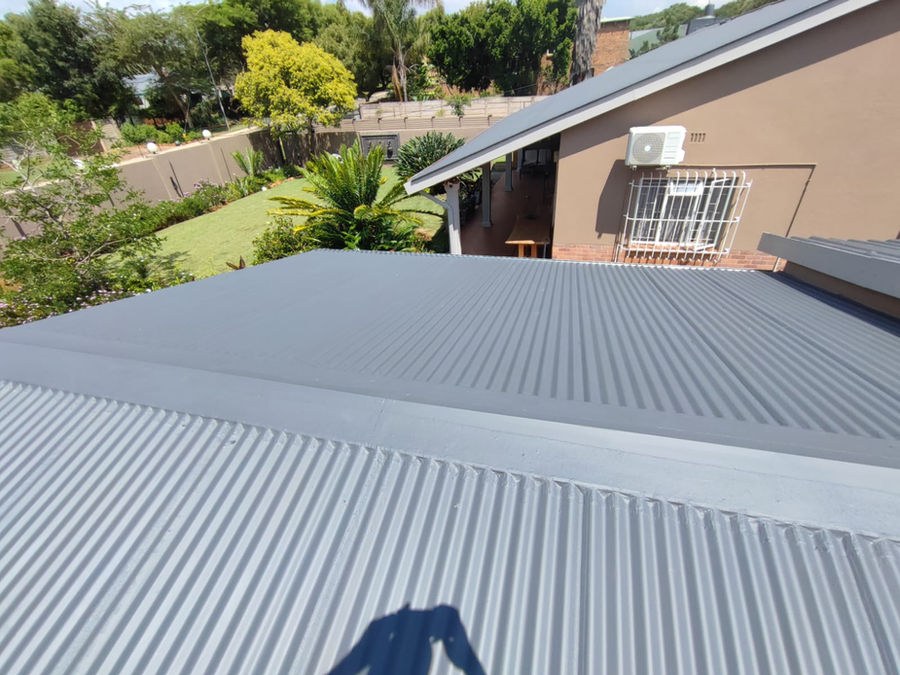A corrugated steel roof beside a house